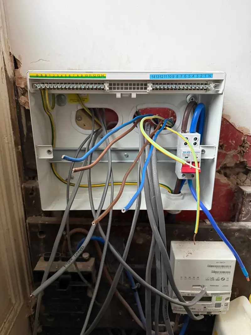 New enclosure on the wall with circuits stripped back