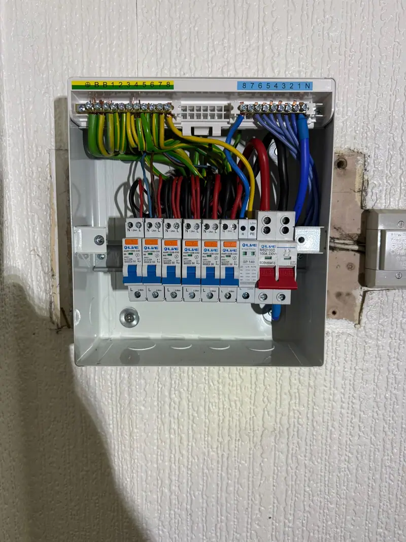 A new six-way metal consumer unit fitted in the same spot