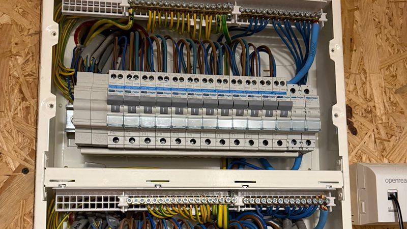 A pair of consumer units we fitted, each circuit on its own RCBO, with the conductors looped in and dressed to the terminal bars.